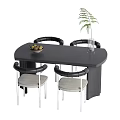 Black Dining Table Set With Four Grey Seated Chairs Silver Legs Fruit Bowl And Plant