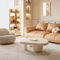 Beige Sofa and White Round Coffee Table Set with Orange Cushions in Warm Living Room