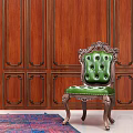 Elegant Green Velvet Single Sofa in Room with Wooden Paneled Walls and Colorful Rug