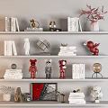 Decorative Ornament Collection with Books Sculptures Vases and Red Figurines on Shelves