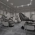 Modern Interior Space Featuring Comfortable Massage Chairs Metal Tables And Green Plants
