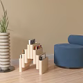 Stylish Blue Single Sofa Interior With Green Plant Beige Spiral Vase And Step Like Bookshelf