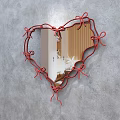 Heart Shaped Mirror with Red Ribbon Bow Frame Reflecting Bedroom Interior and Wooden Walls