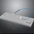 Electronic Components Model With White Platform Blue Wires Connectors And Gray Box