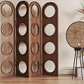 Wooden Room Divider With Circular Cutouts And Folding Panels On Wooden Floor