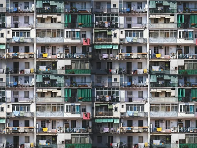 Urban Residential Apartment Buildings With Dense Balconies Hanging Clothes And Green Awnings 3d model