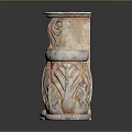 Two Decorative Stone Columns With Carved Leaf Motifs And Orange White Weathered Texture