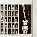 Modern Decorative Cabinet With Grid Shelf Design Displaying Colorful Toy Figures And Accent Figure