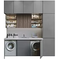 Gray Bathroom Cabinetry with Open Shelves Holding Toiletries Wooden Backsplash Sink Countertop and Washing Machines