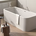 White Freestanding Bathtub With Side Table Towel And Wooden Stool In Modern Bathroom