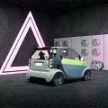 Green And Gray Compact Two Seater Car With Transparent Roof And White Triangle Neon Light