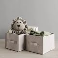 Gray Fabric Storage Baskets With Handles Holding Lion Plush And Green Clothes