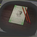 Portrait Sketch on Paper with Two Pencils on Wooden Table Surface