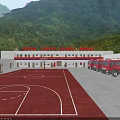 Industrial Factory With Red And White Exterior In Mountainous Green Landscape