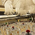 Luxury Spacious Banquet Hall With Unique Ceiling Decor And Elegantly Arranged Round Dining Tables
