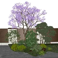 Purple Flowering Tree in Garden with Green Shrubs Wooden Fence and Stone Path