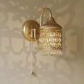 Elegant Golden Carved Wall Lamp With Crystal Decoration On Patterned Wall