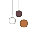 Three Colorful Ceramic Pendant Lights in White Brown Orange with Gold Accents on Light Background
