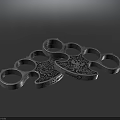 Metal Brass Knuckles With Decorative Skull Pattern And Multiple Finger Holes