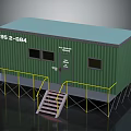 Green Container Building With Windows Door Yellow Railings And Red Stairs