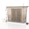 Textured Fabric Curtain With Patterned Design Hanging On Rod And Decorative Items