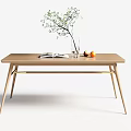 Minimalist Natural Wood Dining Table With Clear Vase Green Twigs Open Book And Fruits