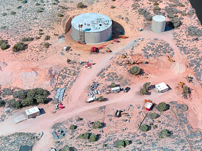 Desert Industrial Facility Aerial View With Two Large Cylindrical Tanks Vehicles Small Buildings and Vegetation 3d model