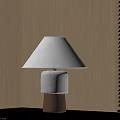 Modern Table Lamp With Beige Lampshade And Textured Brown Base On Black Cabinet