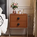 Wooden Bedside Table With Drawers Black Knobs Metal Legs And Vase With Flowers