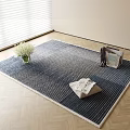 Blue Striped Square Rug with Fringe Edge Featuring White Flower Vase Woven Basket and Cloth Bag