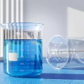 Transparent Medical Laboratory Glass Beakers With Blue Liquid And Graduated Scale