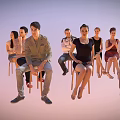 Group of people seated on wooden chairs against light background