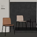 Modern Dining Chairs In Orange Beige Black With Black Metal Legs Against Gray Wall