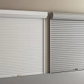 White And Gray Roller Shutters Installed Side By Side On Home Exterior Wall