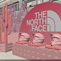 Pink The North Face Themed Floral Installation With Cactus Sculptures And Helmets On Shelves