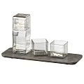 Modern Transparent Glass Cups With Textured Design On Wooden And Stone Trays