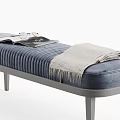 Navy Blue Velvet Ottoman Bench With Vertical Tufted Gray Legs and Cozy Blanket on Top