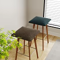 Padded Bar Stools In Dark Green And Brown With Wooden Legs Indoor Near Green Plants
