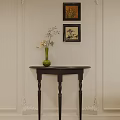 Elegant Dark Wood Console Table With Green Vase Flowers Branches And Framed Paintings