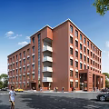 Red Brick Multi Story School Building With Balconies Trees Pedestrians And Clear Blue Sky