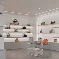 Elegant Modern Clothing Store With Stylish Bags Displayed On White Shelves And Glass Tables