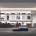 Modern Spacious Walk-in Closet Interior With Built-in Cabinets Hanging Clothes And Storage Drawers