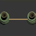 Two Green Spiral Decorative Objects With Light Colored Board In Between