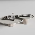 Nested Round Coffee Tables with Light Gray Top Ribbed Gold Base Glass Cups and Magazine