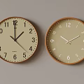 Two Wall Clocks With Beige Dials Brown Frames Showing Different Times On Light Gray Background 3d model