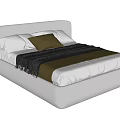 Modern Upholstered Double Bed With Soft Headboard Plush Pillows And Textured Blanket