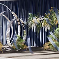 Modern Banquet Hall With Dark Blue Curtains And Metal Circular Floral Decorations