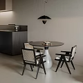 Round Black Dining Table With Rattan Back Chairs White Vase And Pendant Light In Modern Space