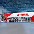 Yamaha Red And White Exhibition Booth With Truss Structure Motorcycles On Display And Reception Counter