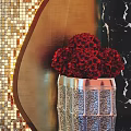 Elevator Hallway With Golden Mosaic Wall Sculpture Mirror And Red Flower Arrangement